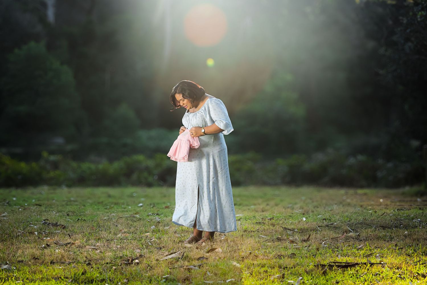 Atmospheric series of photos showing an ethereal white-dressed figure twirling in a misty meadow at sunrise.