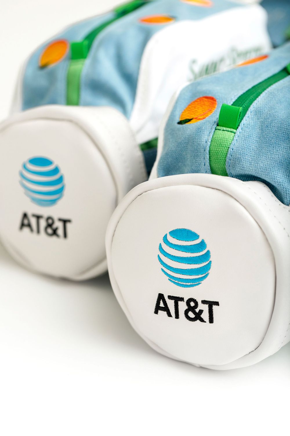 Two AT&T branded promotional toy cars with white wheels featuring the AT&T globe logo on a white background.