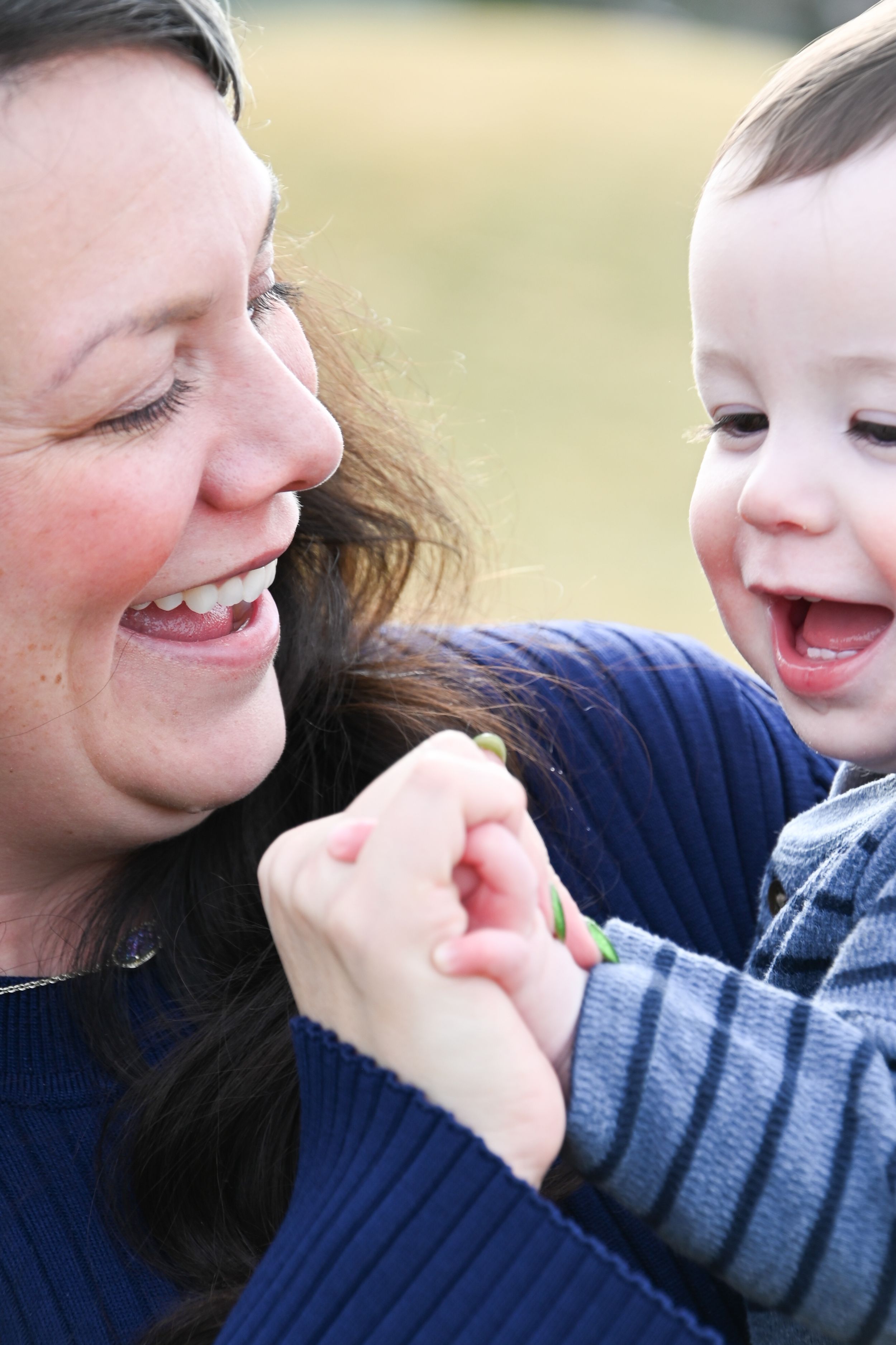Close-up series showing a joyful expression and laughter unfold in sequence across several frames.