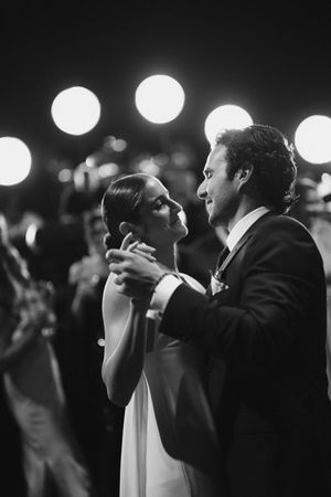 A series of black and white photographs show a couple dancing intimately at what appears to be a formal event.