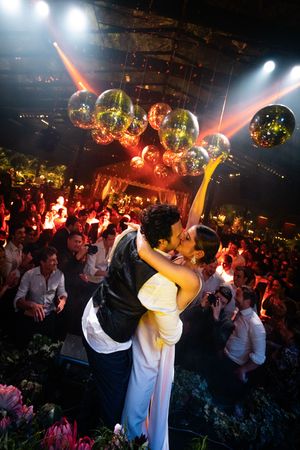 A series of photos showing a lively nightclub party with disco balls, colorful lighting and people dancing on a crowded dance floor.
