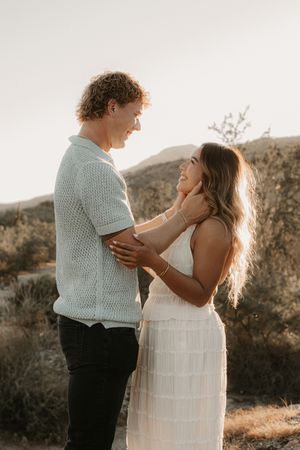 Warm and candid couples photography captured outdoors in Goodyear Arizona.