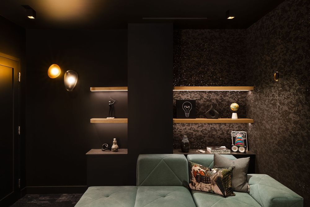 Modern theatre room interior with dark wallpaper, wooden cabinetry, and warm accent lighting creates a luxurious atmosphere.