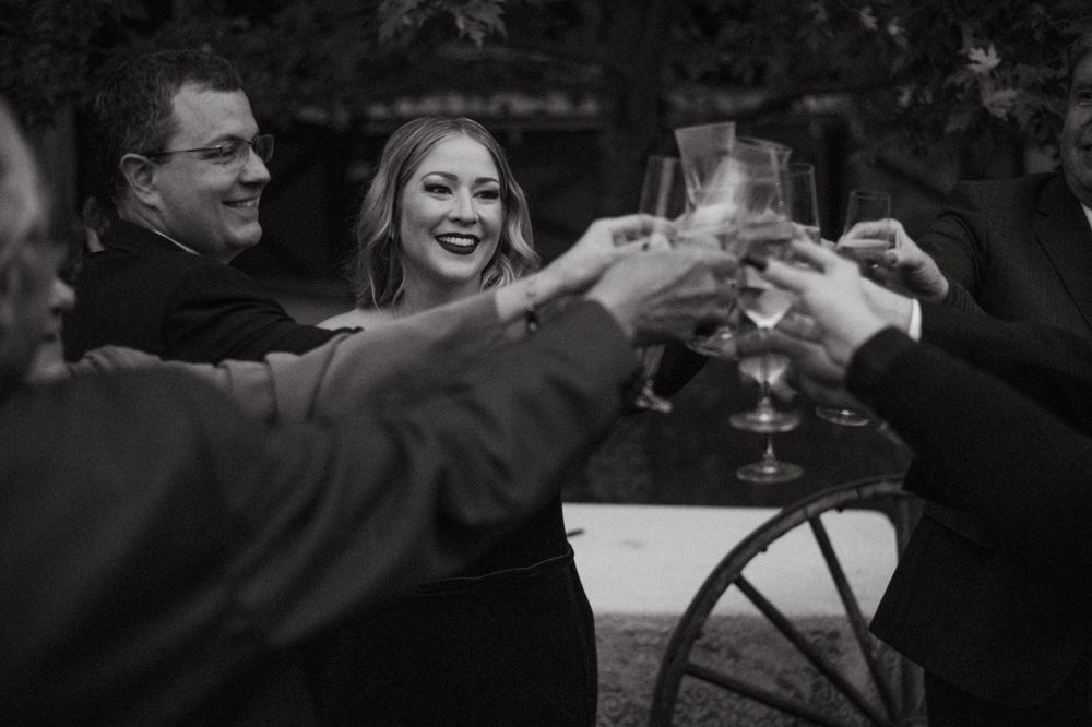 Black and white photos show a couple dancing and celebrating together at what appears to be a wedding reception.