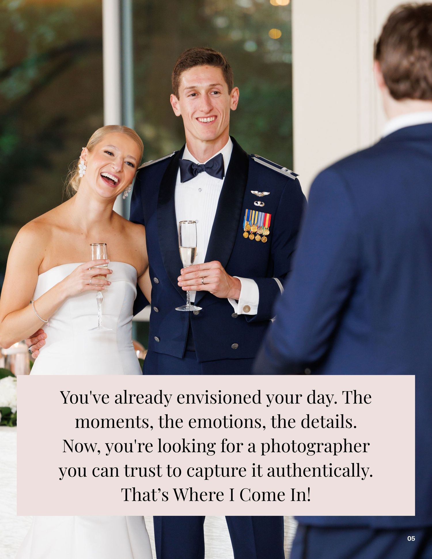 A smiling bride and groom in military dress uniform share a champagne toast at their elegant wedding reception.