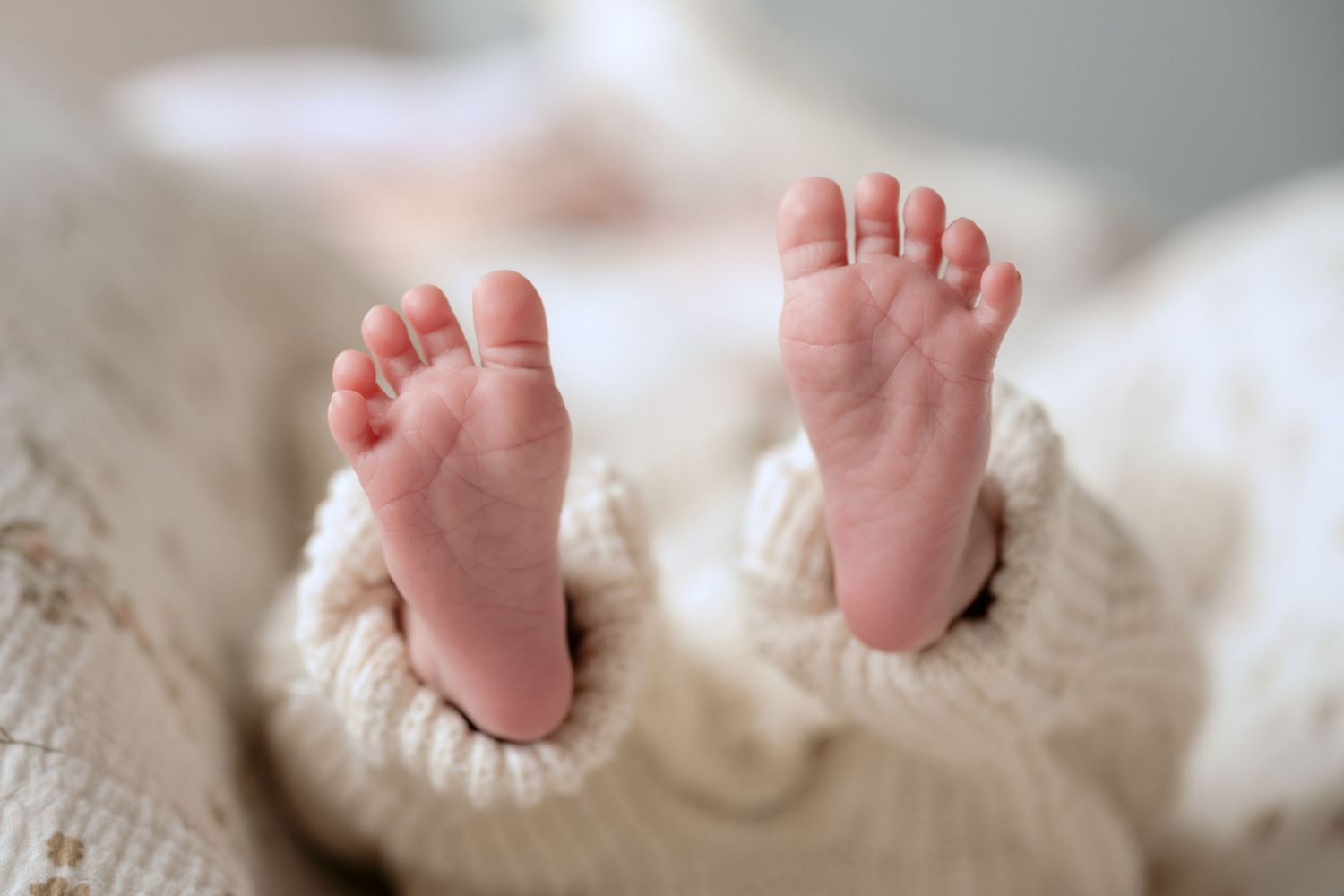 closeup of newborn baby's flexed feet during in-studio lifestyle newborn session in stillwater, mn