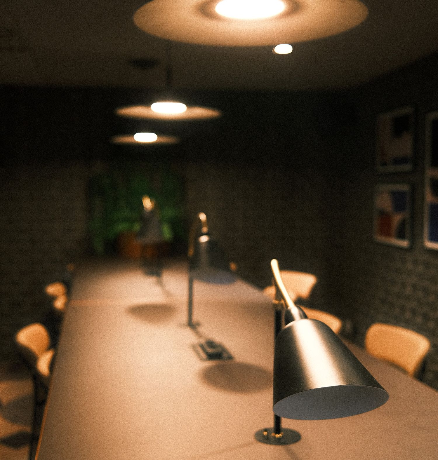 Modern conference room with sleek desk lamps on a long table, pendant lights, and wooden chairs in a dimly lit setting.