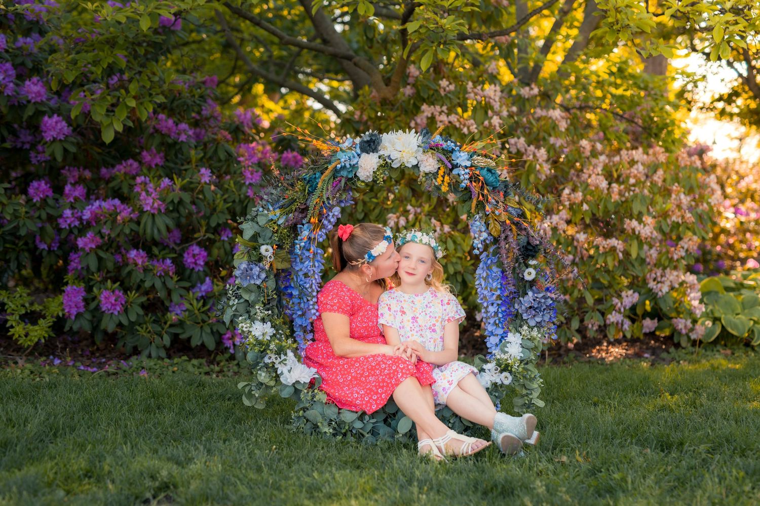 Mother and daughter portrait beneath a handcrafted floral hoop at Kings Navy Yard Park in Amherstburg, Ontario.