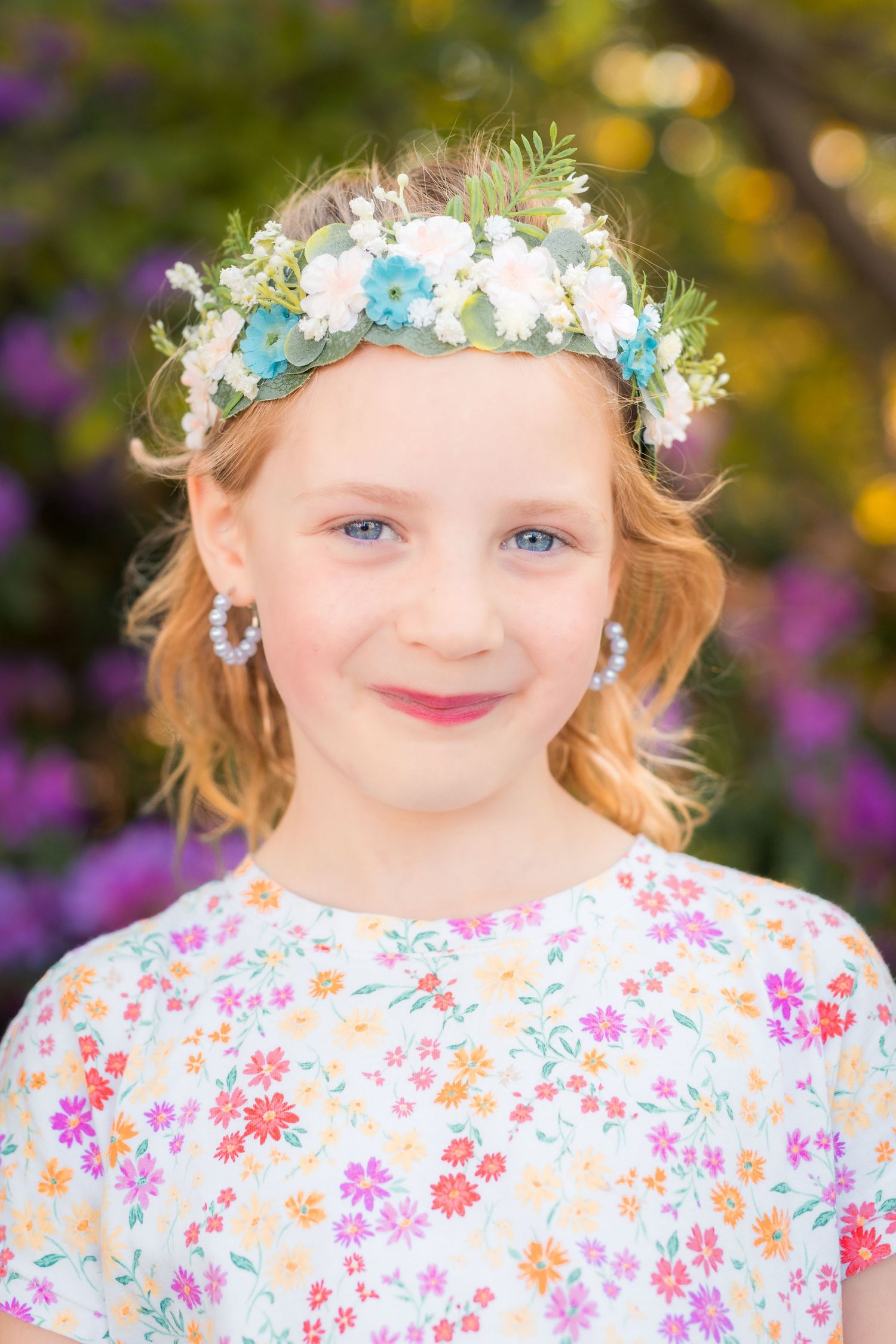 Portrait of a young girl sitting beneath a handcrafted floral hoop in Amherstburg.