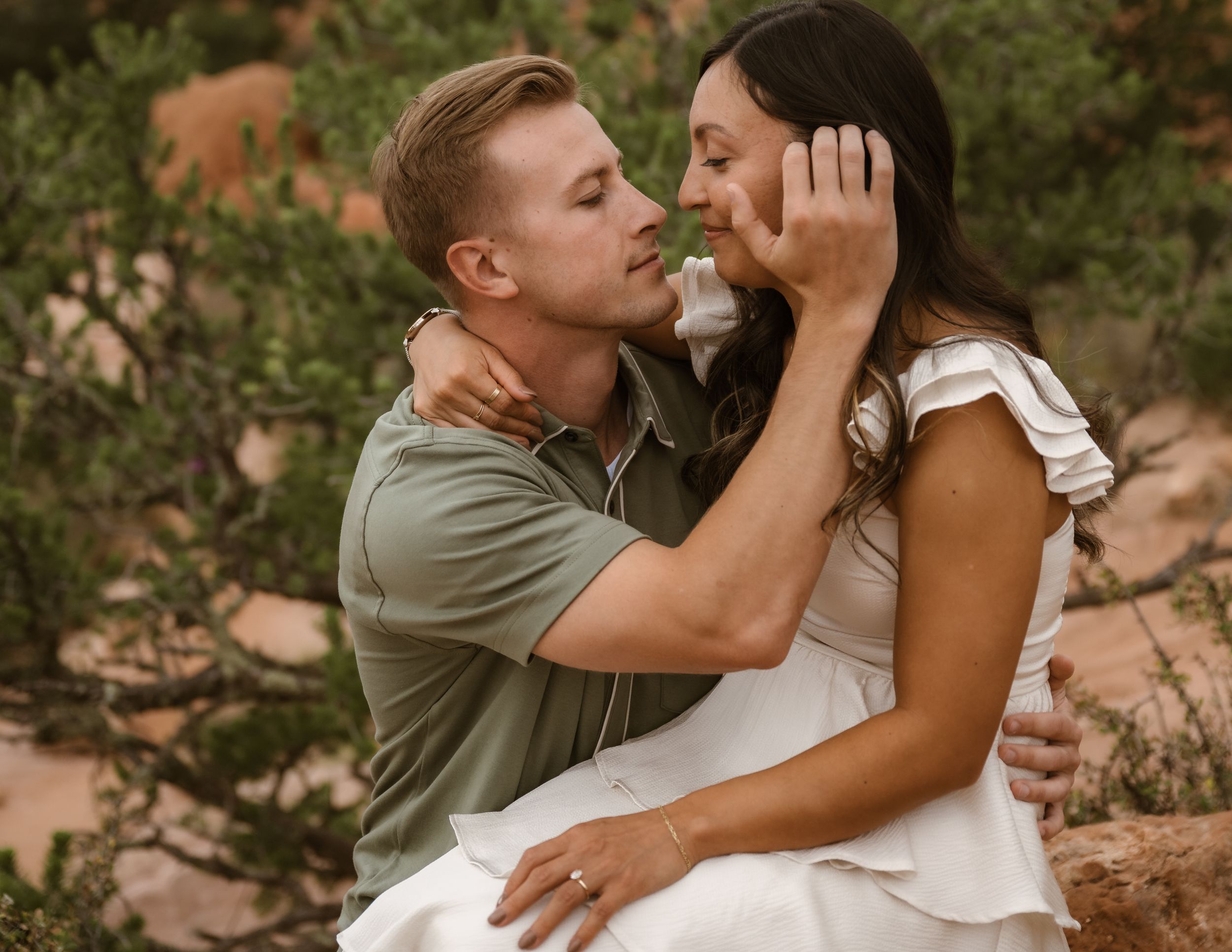 Close-up shots of an affectionate couple sharing intimate moments outdoors.