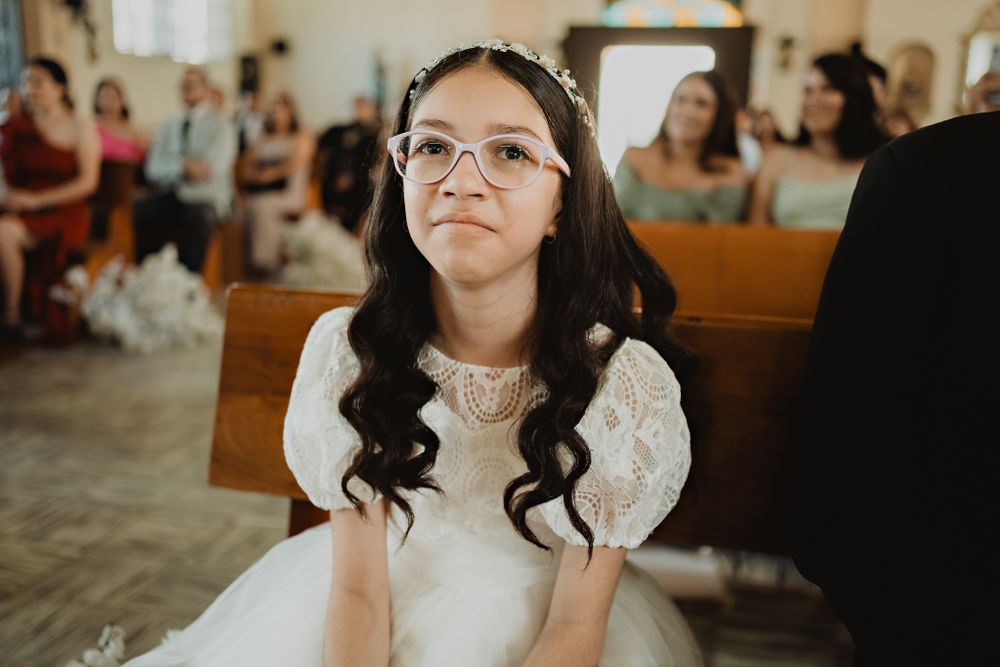 The bride's sister with tears of joy, capturing the emotion of the day in a wedding photography moment