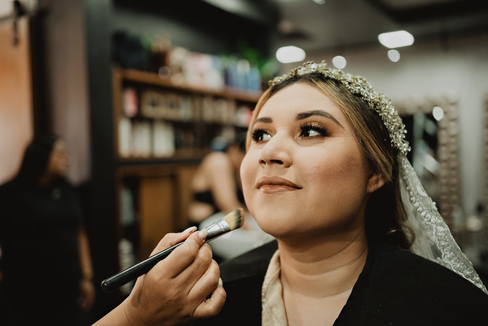 Bride's makeup, capturing the beauty moment before the ceremony, a highlight for any wedding photographer