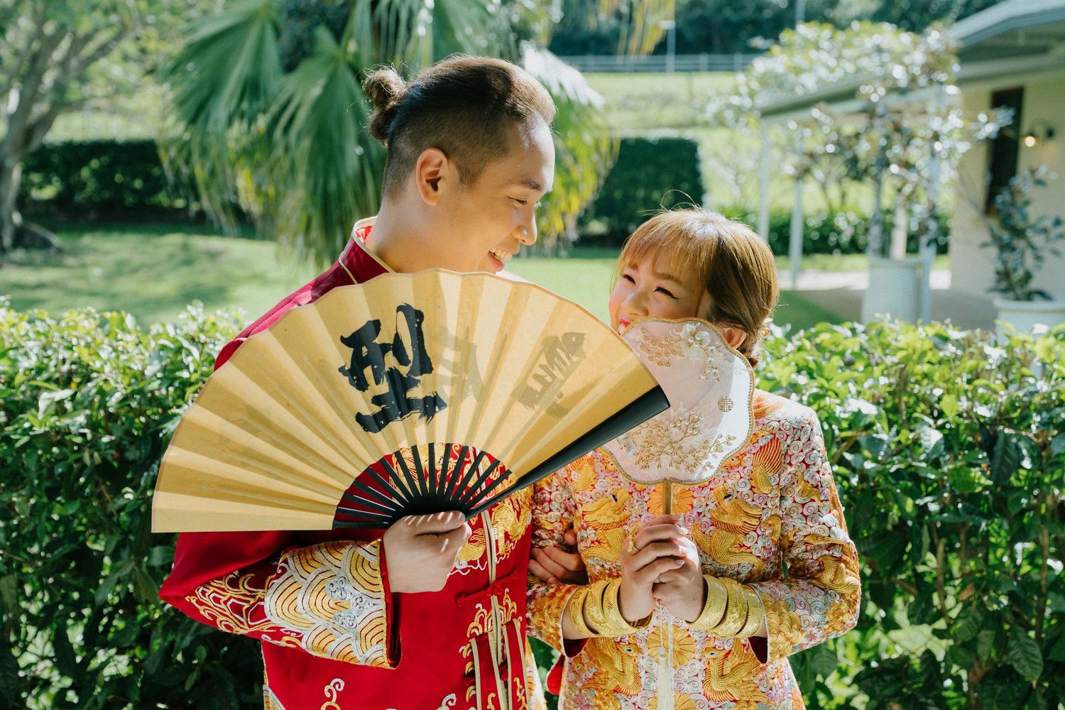 "Bride and groom in traditional attire during tea ceremony at Sunshine Coast venue"