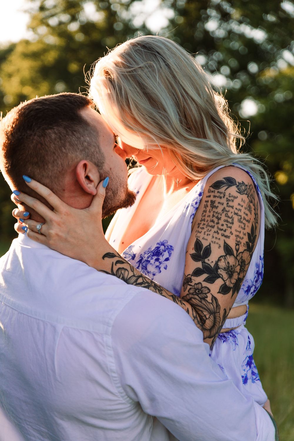 Sunset photoshoot showing intimate moments between couple in coordinated outfits.