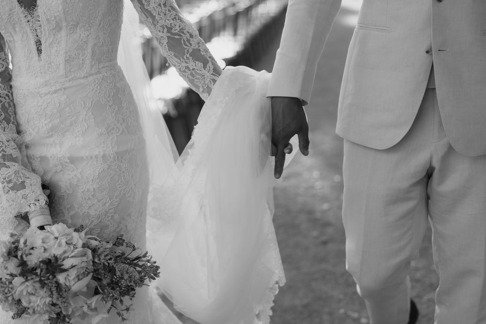 A bride and groom share their first dance together surrounded by soft lighting at their wedding reception.