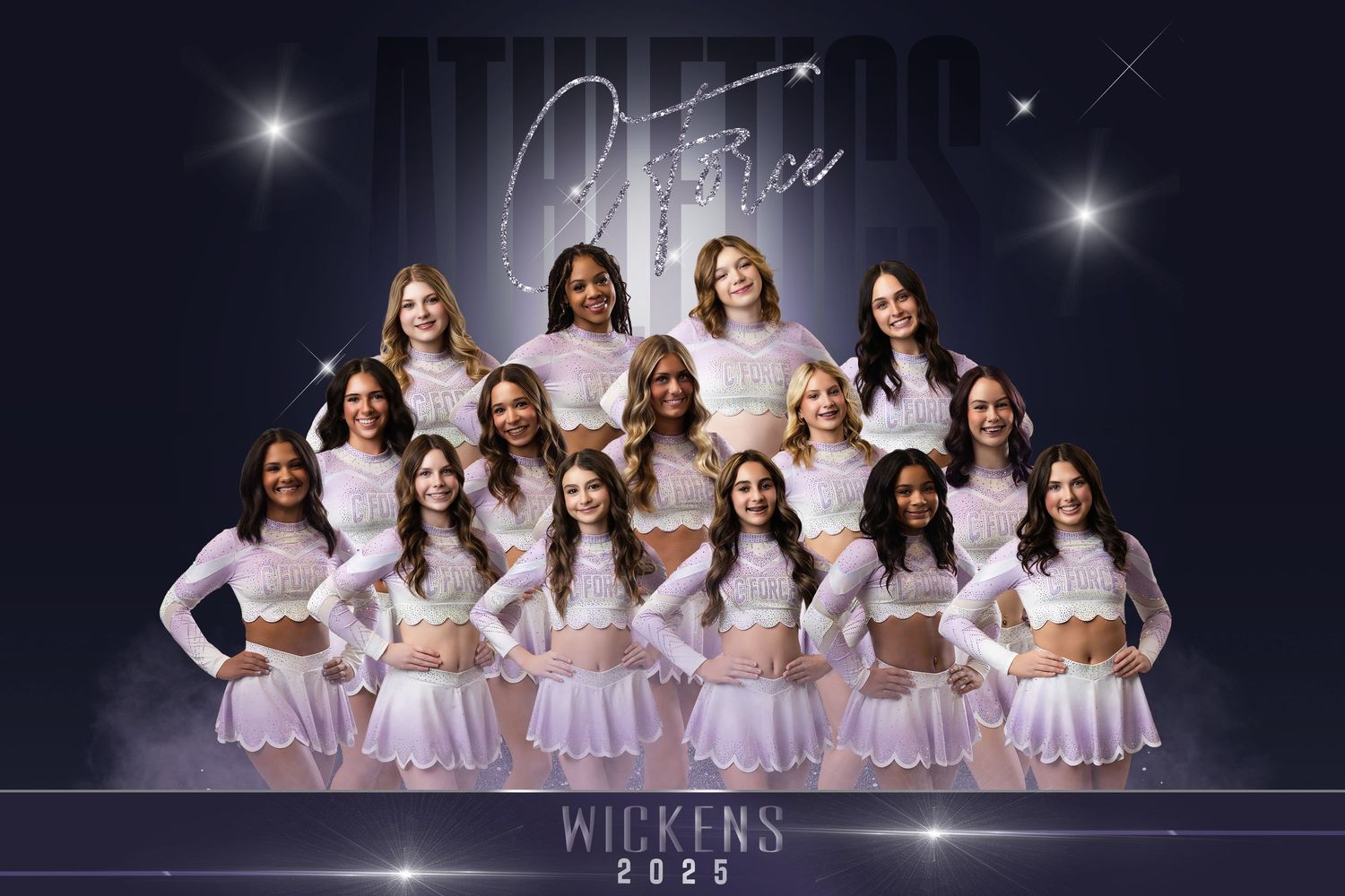 A group of dancers in white dresses pose gracefully in a dark studio with twinkling lights overhead.