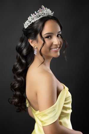 Glamorous portrait series showing an elegant yellow off-shoulder gown with sparkling crown and jewelry against dark backdrop.