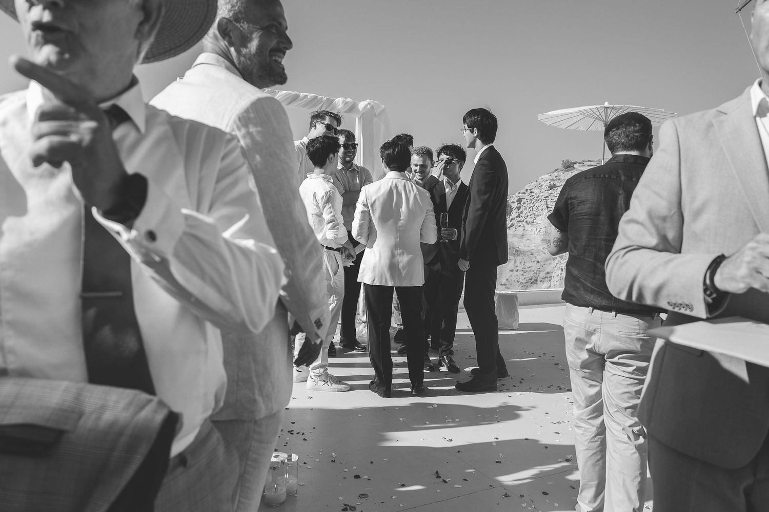 Santorini wedding guests assorted in groups at El Viento Wedding.