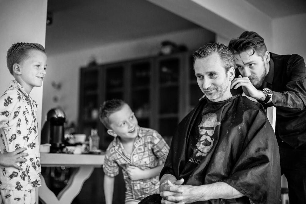 Black and white photograph of daily life moments in a home setting.