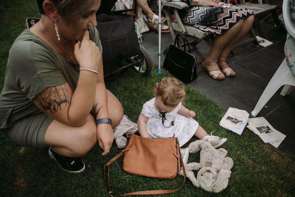 Candid outdoor moment showing tattoo and casual summer gathering details.