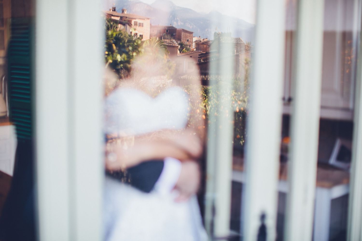 couple overlooking mallorca mountain village during pre wedding photoshoot