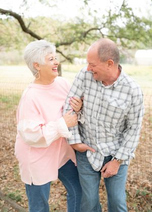 A couple shares joyful laughter together outdoors in a series of candid connected photos.