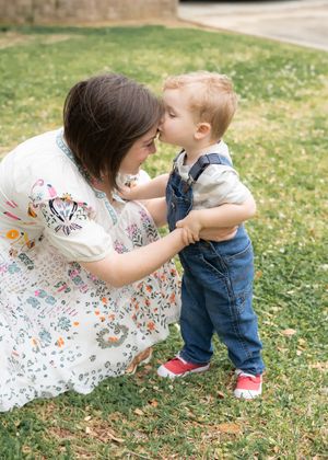 Sweet candid moments captured between family members on a sunny spring day.
