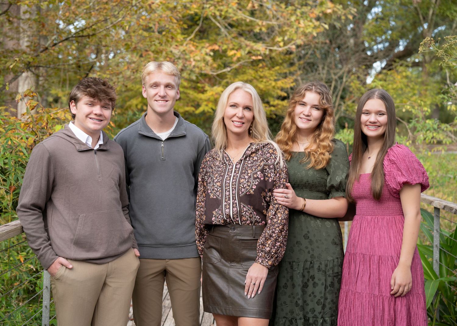 A series of casual outdoor family photos showing people posing together in coordinating outfits during autumn.