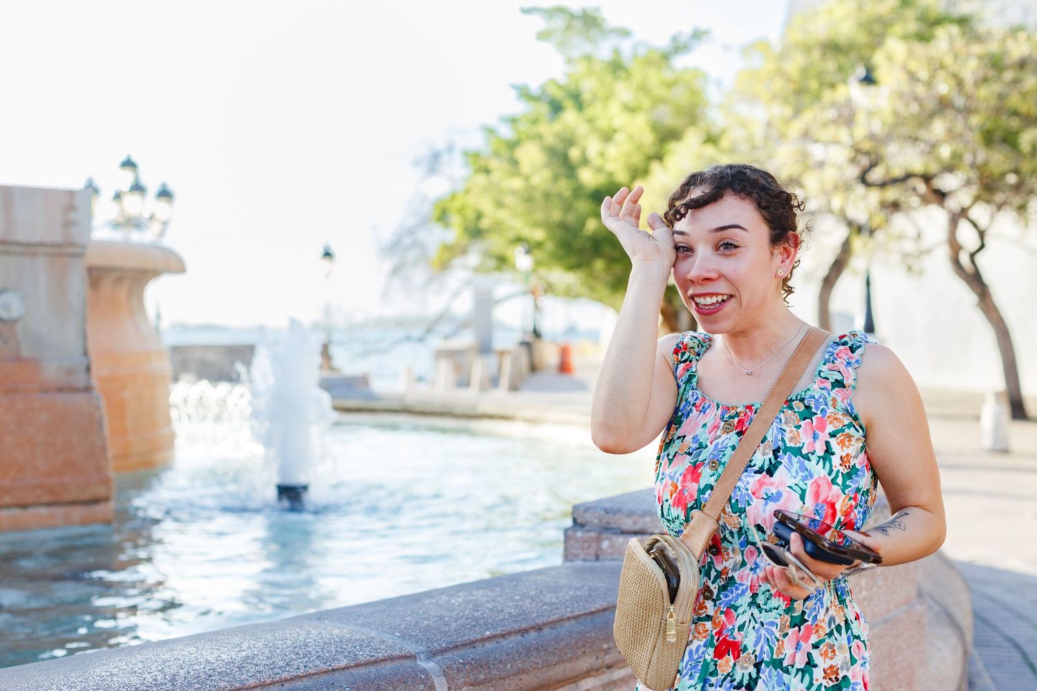 Woman crying happy tears. Marriage proposal at Fuente Raíces in Old San Juan, Puerto Rico.