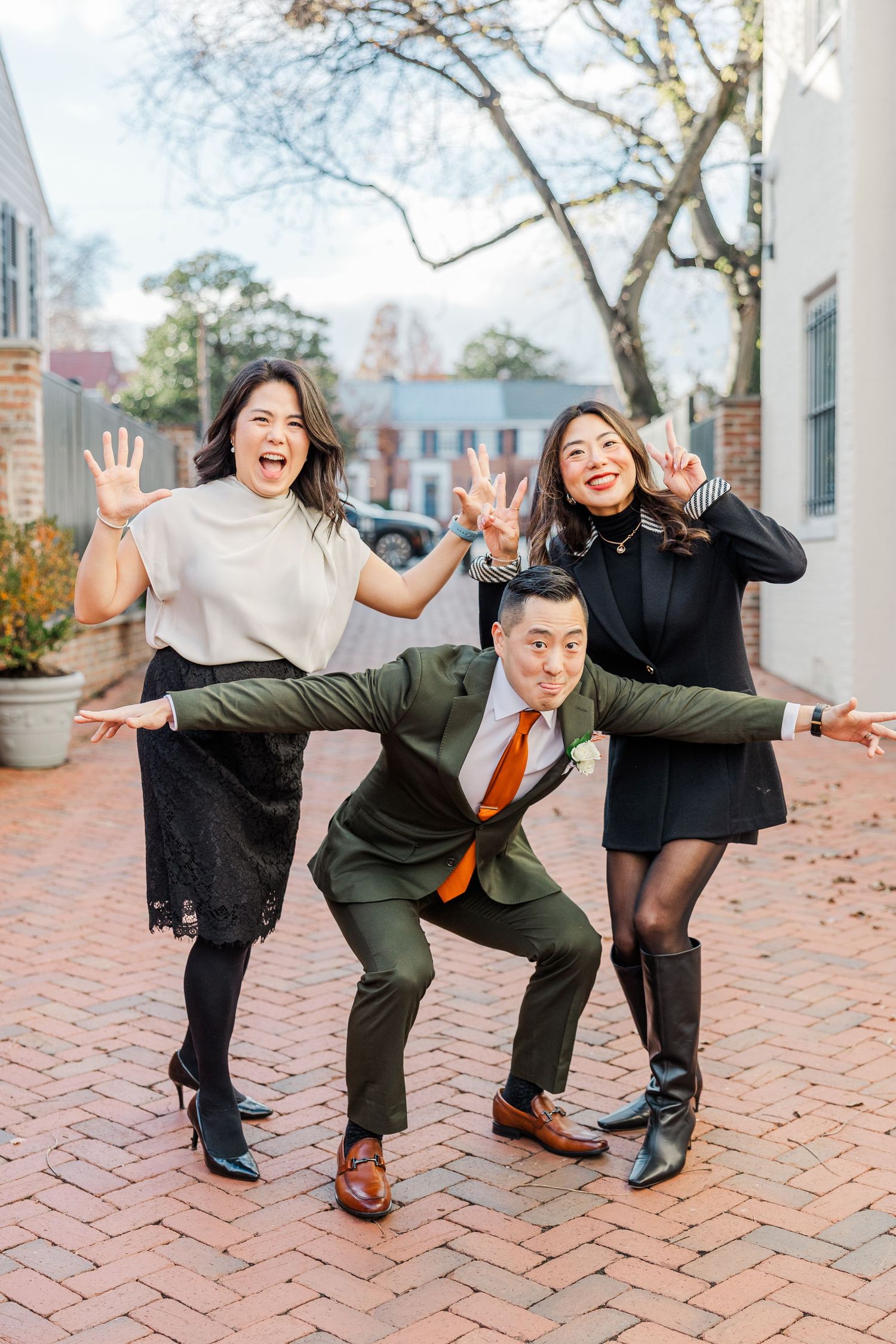 Four sequential photos show a playful couple dancing and posing with silly expressions on a brick walkway.