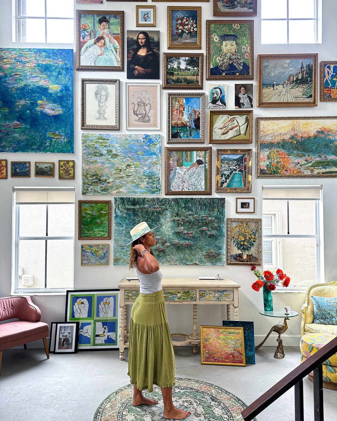 Vibrant painting of water lilies on a pond surrounded by drooping willow branches in rich greens and blues. Monet Kim ahonoukoun  legacy