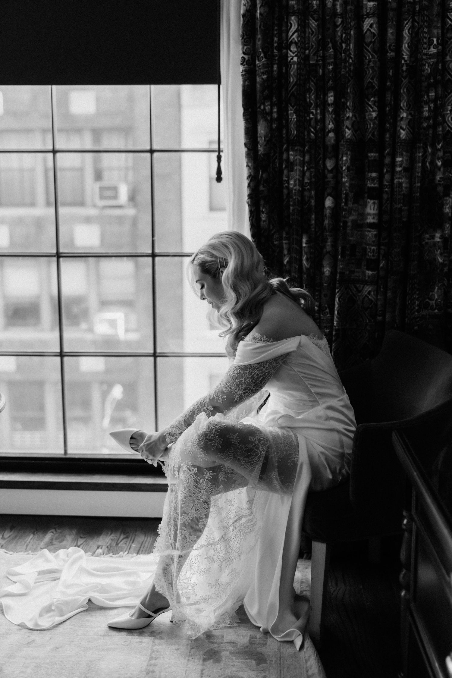 A series of black and white photos showing a figure in white sitting by a window in different contemplative poses.