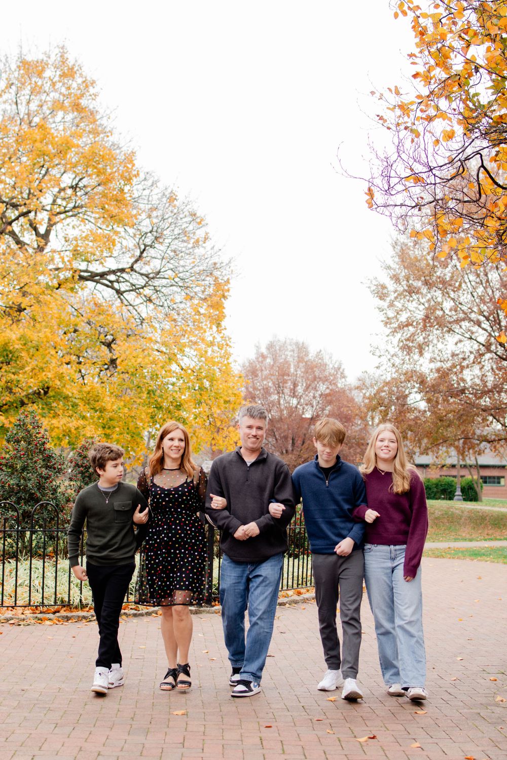 A group walking together along a brick path in autumn, showing a creative photo sequence from different angles.