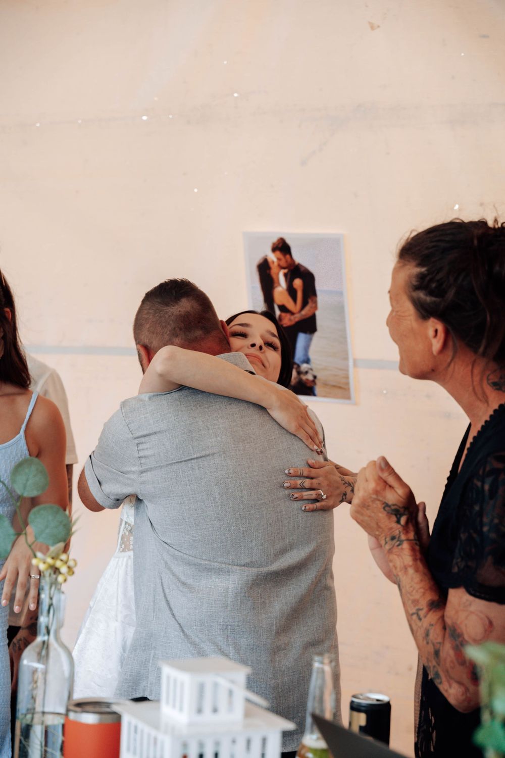 Emotional moments shared between guests at a wedding celebration.