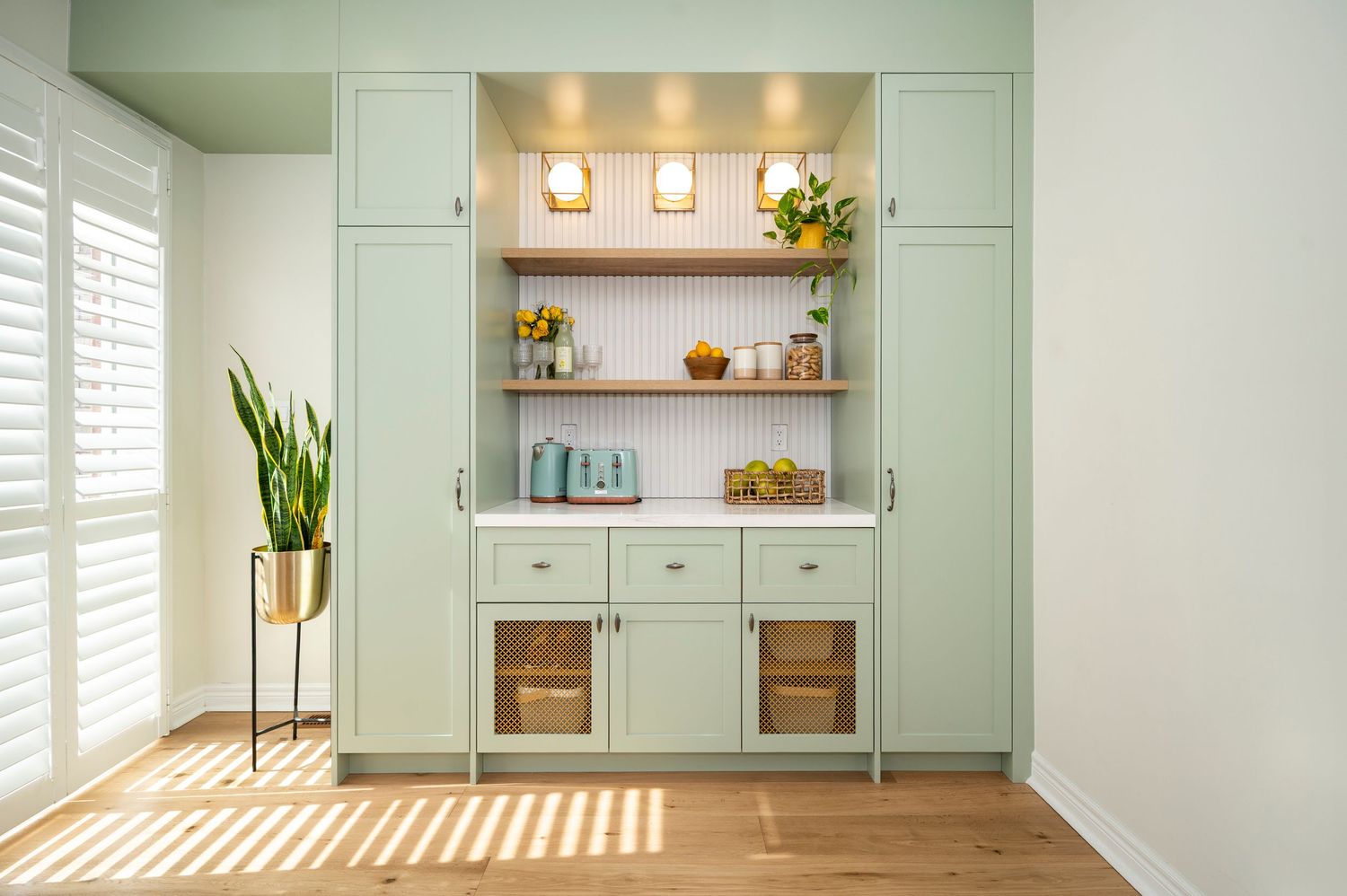Clean interior design in light green tones and natural daylight, captured for real estate photography by Alex Korin.