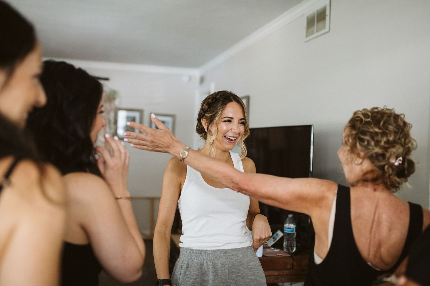 A joyful getting ready moment with friends on the wedding morning.