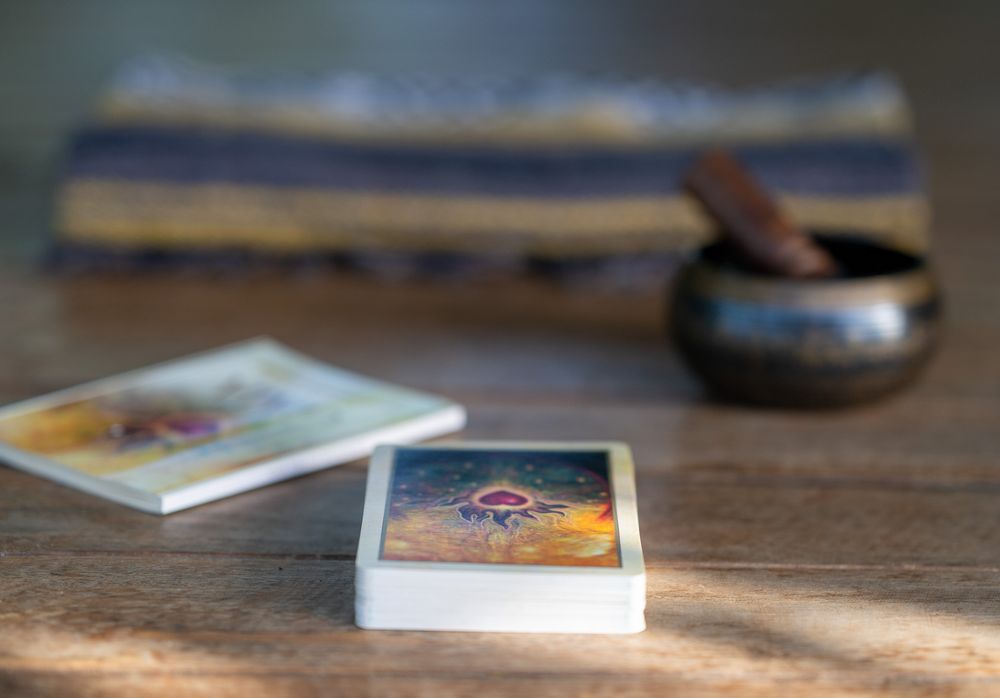 Books lay scattered across a wooden surface in a bokeh blurred sequence of shots showing varying focus depths.