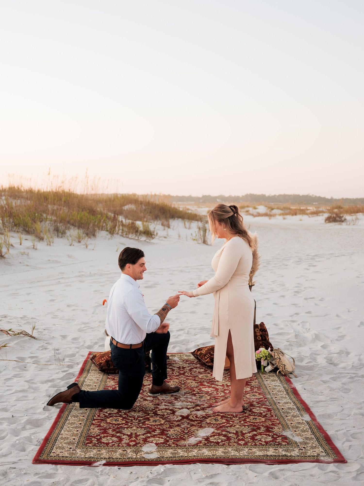 couples propose on the beach