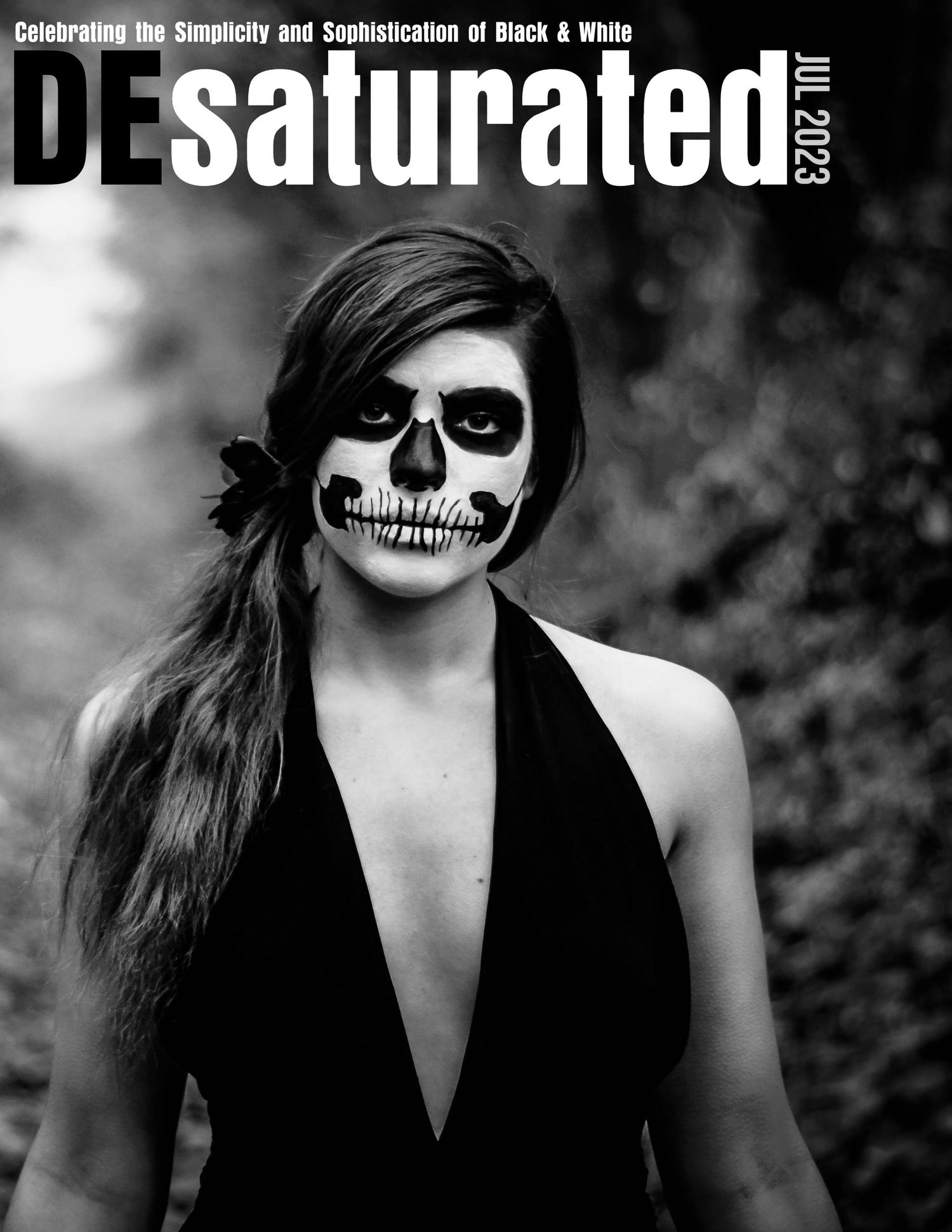Magazine cover featuring dramatic skull face paint makeup in black and white.