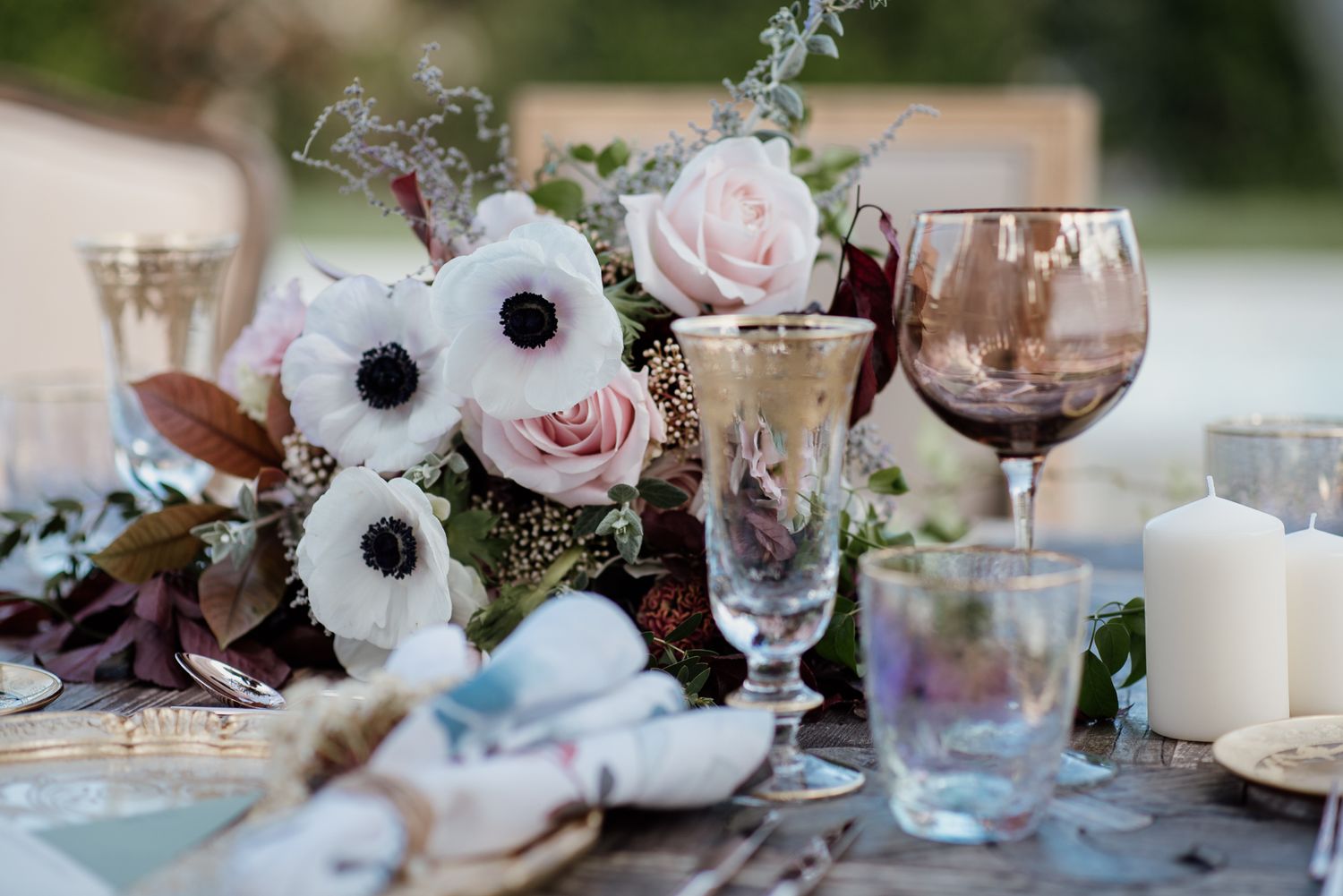a cinematic photo of contemporary spring wedding decoration with anemones and roses