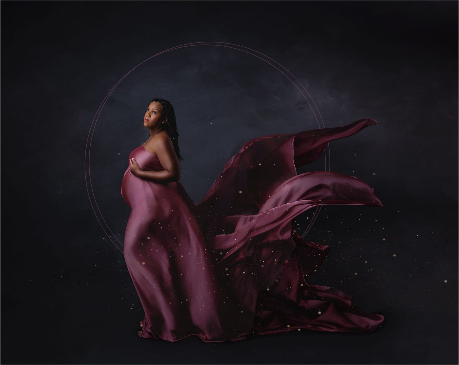 dramatic materity portrait black mom draped in pink silk captured by valerie kay photography.