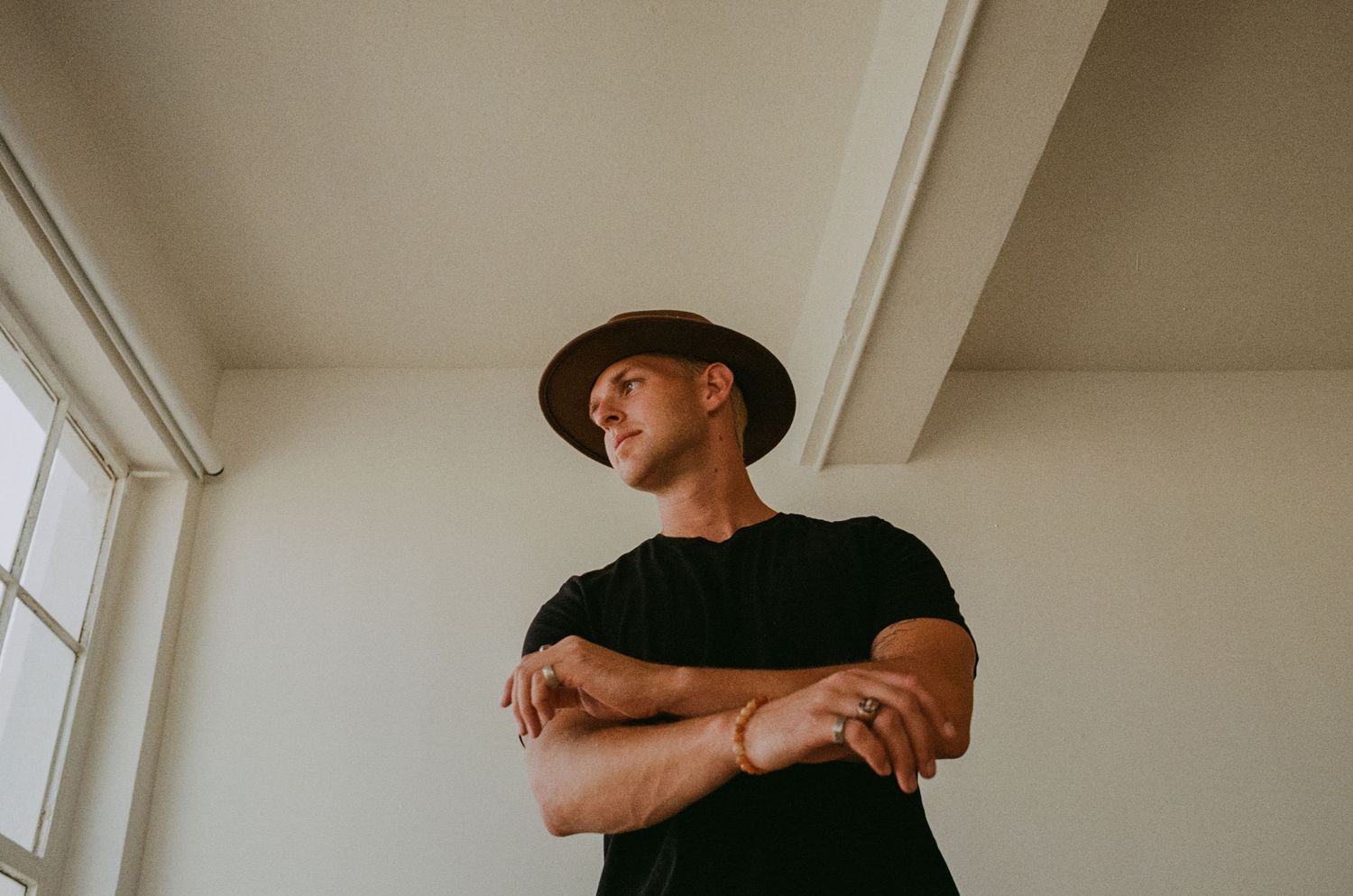 Studio photograph of man wearing a hat in downtown Los Angeles