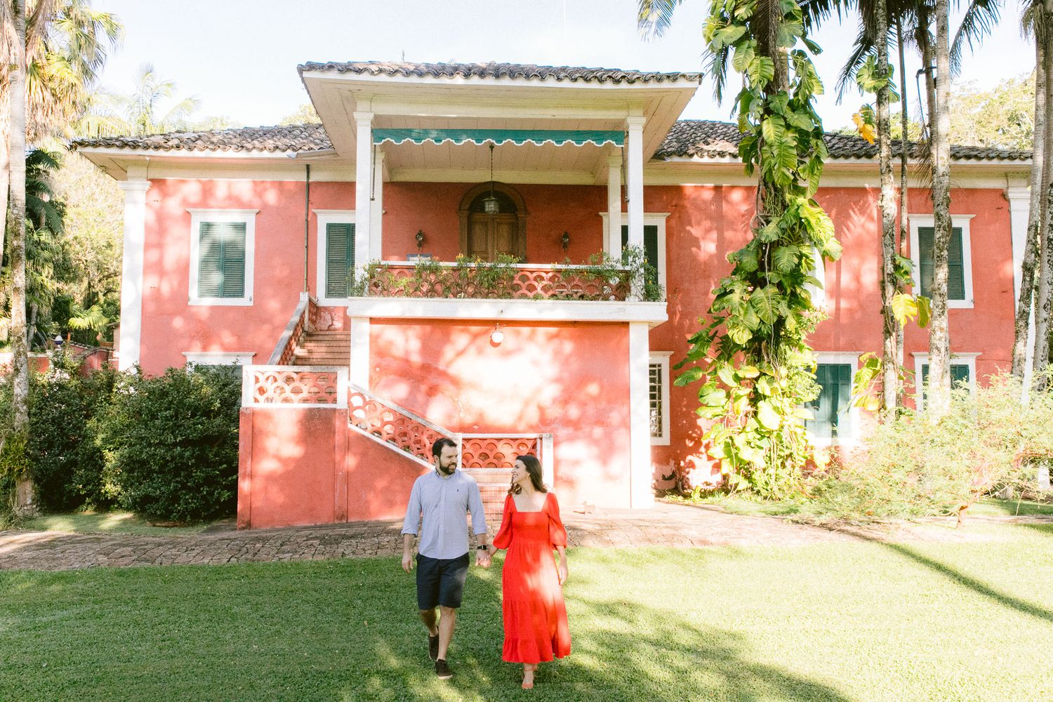 Pink Mediterranean-style villa with rustic charm and lush garden setting for a wedding celebration.