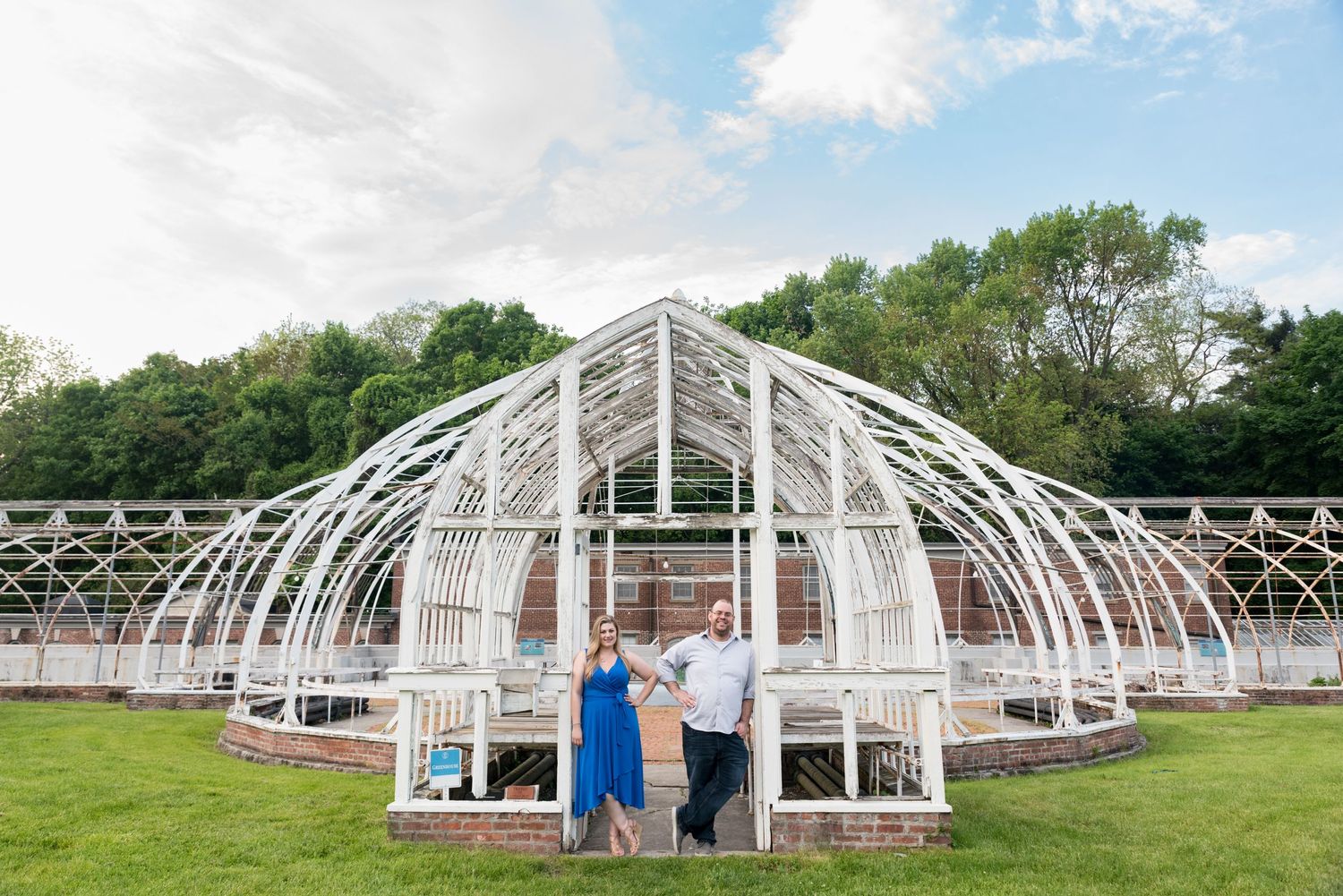 Engaged couple pose at the greenhouse on Lyndhurst Mansion destination engagement portraits Leah Ramuglia photography