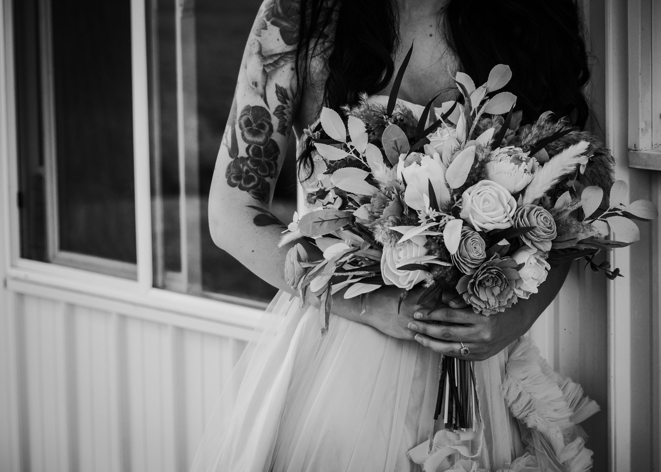 Close up of bride holding bouquet.