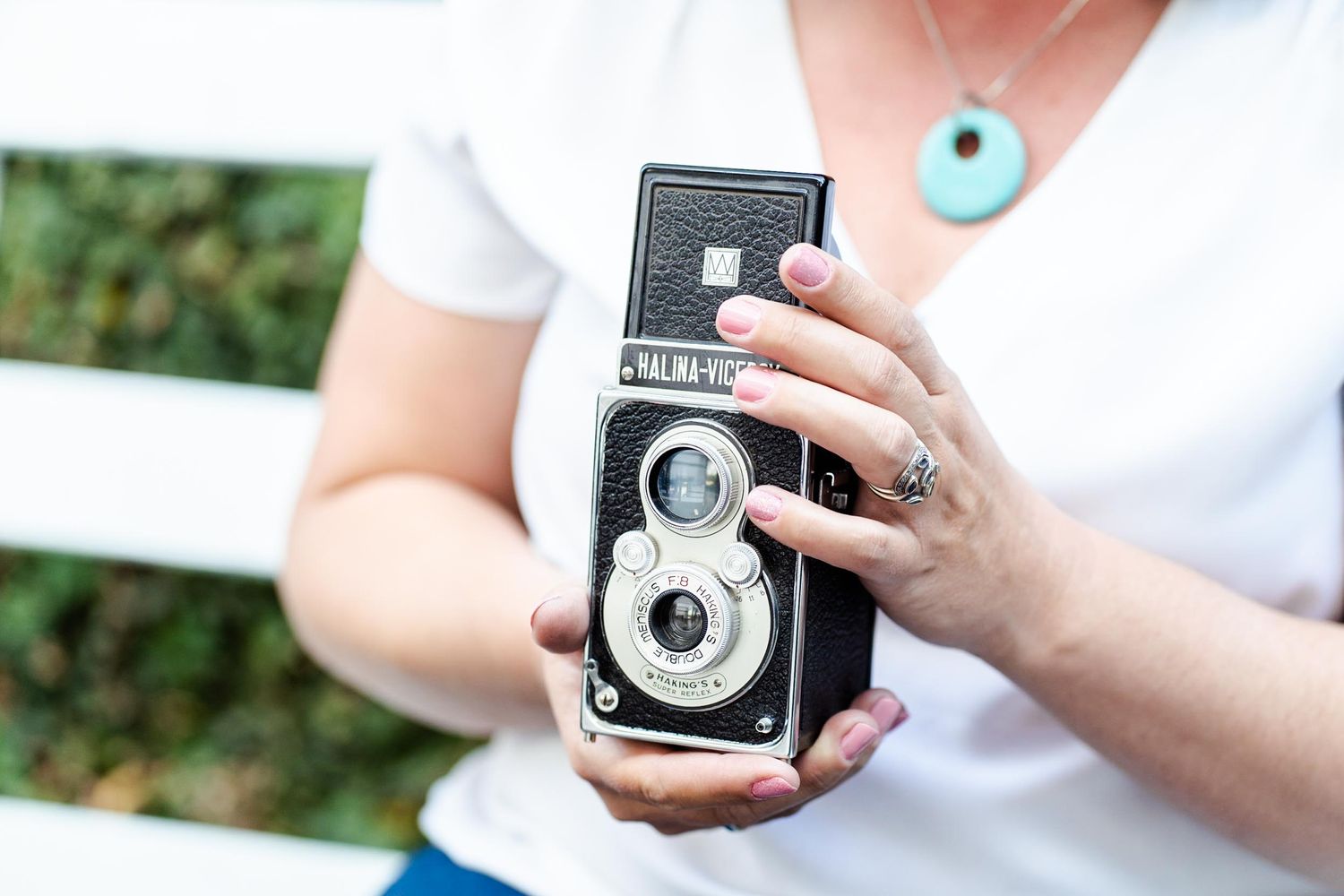 Lady holding vintage camera