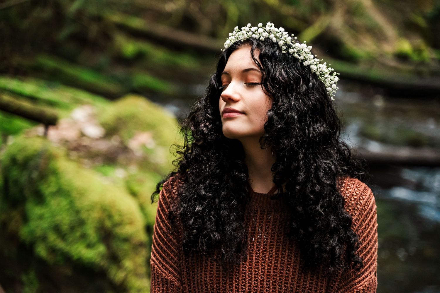 Senior girl in a peaceful pose at Whatcom Falls Park in Bellingham, WA