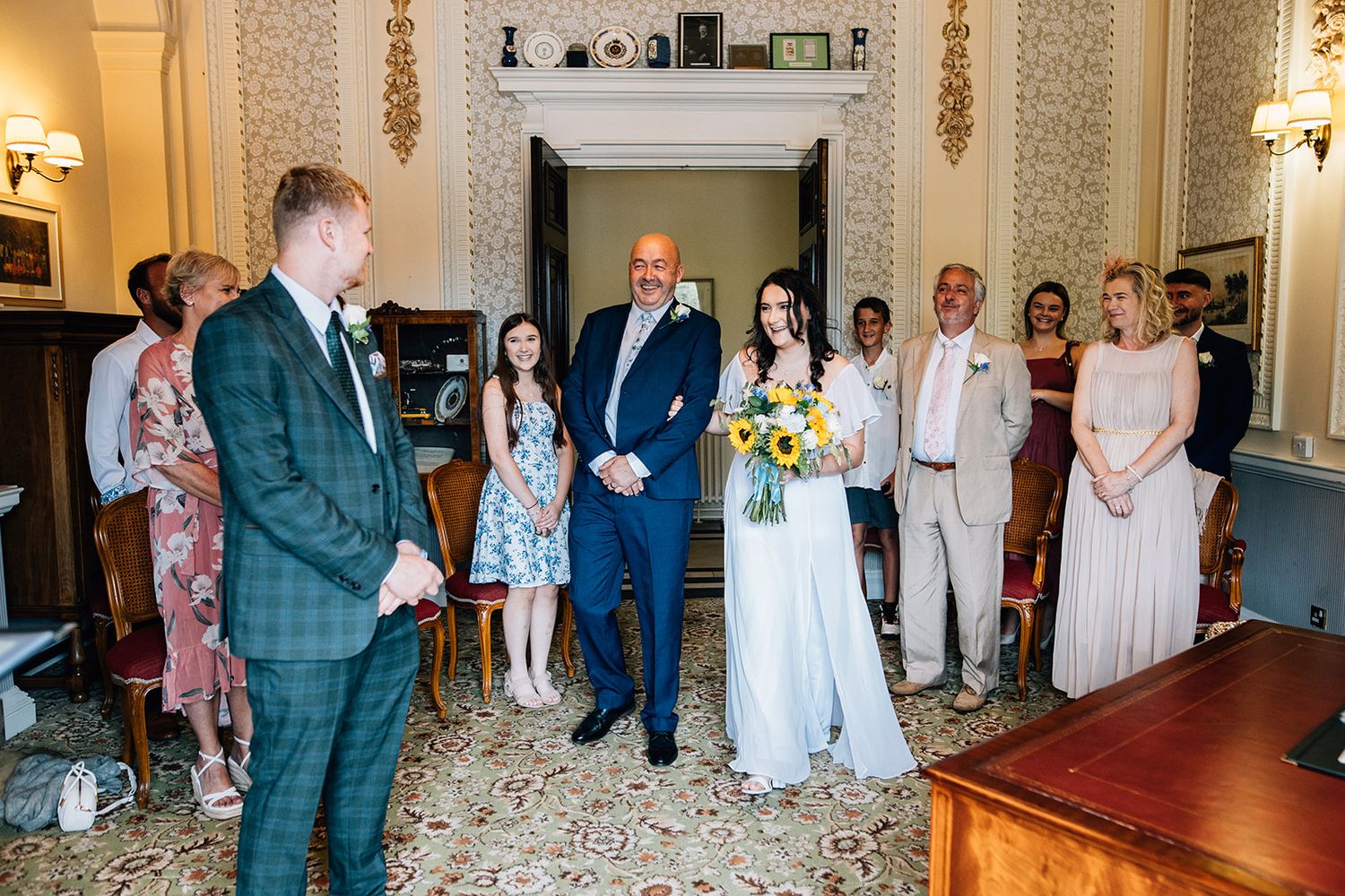 A wedding celebration collage showing elegant reception moments with guests in formal attire in a classic venue setting.