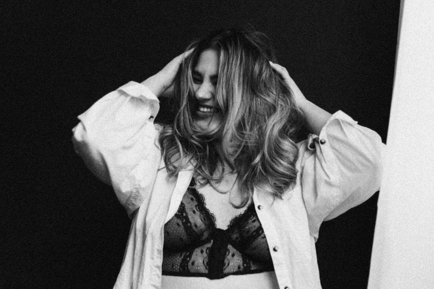 Black and white portrait series showing expressive movement and poses against a dark background.