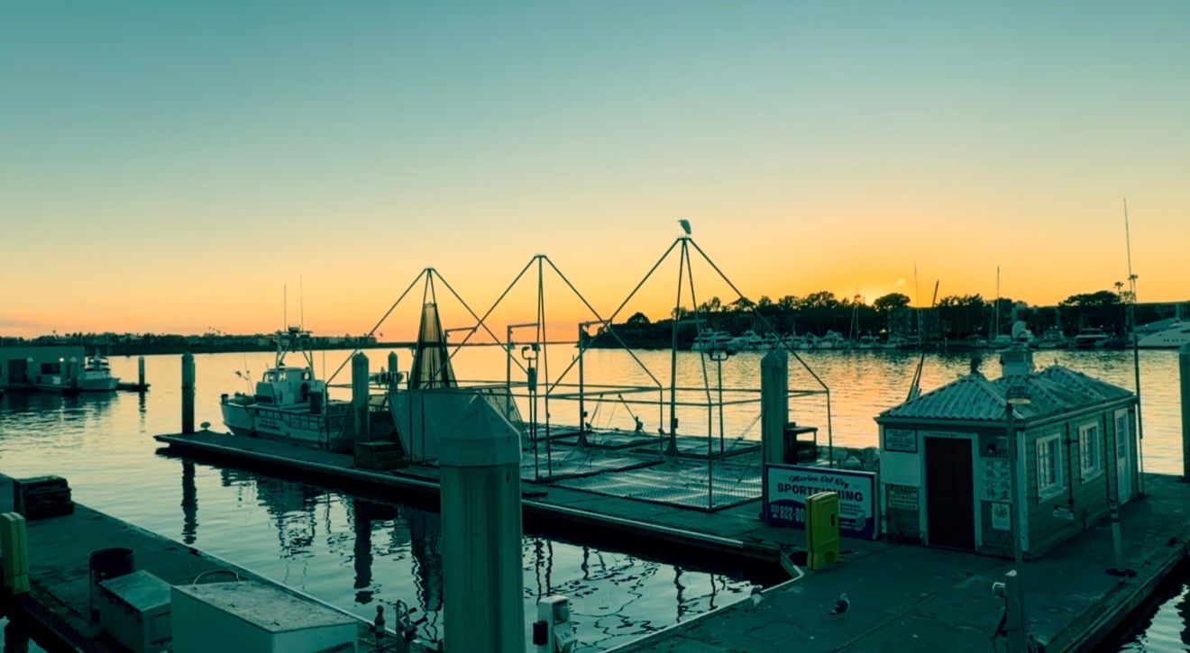 A series of six panoramic coastal scenes showing docks, boats, and waterfront structures at sunset.